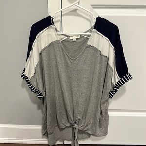 Gray shirt sleeved women’s t shirt with tie up front and accent striped sleeve